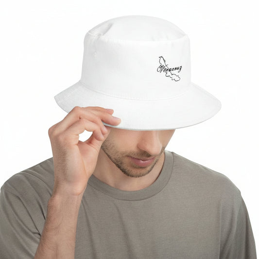 A man wearing a white Veracruz fisherman's hat with a small black logo on the front.