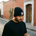 Generales de Durango Cuffed Beanie, Black, One Size | Create an ultra-photorealistic lifestyle photograph featuring the uploaded hat as the only source of truth.