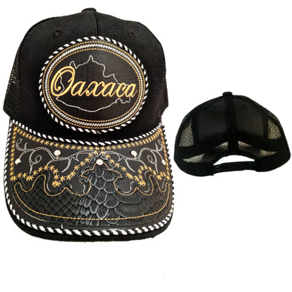 Black charro-style cap with embroidered snake-skin design and Oaxaca badge, adjustable