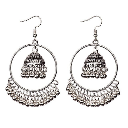 A pair of golden tassel jhumka earrings with intricate geometric patterns and small pearl-like adornments.