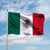 Waving Mexico flag on pole: green, white, red with coat of arms in center.