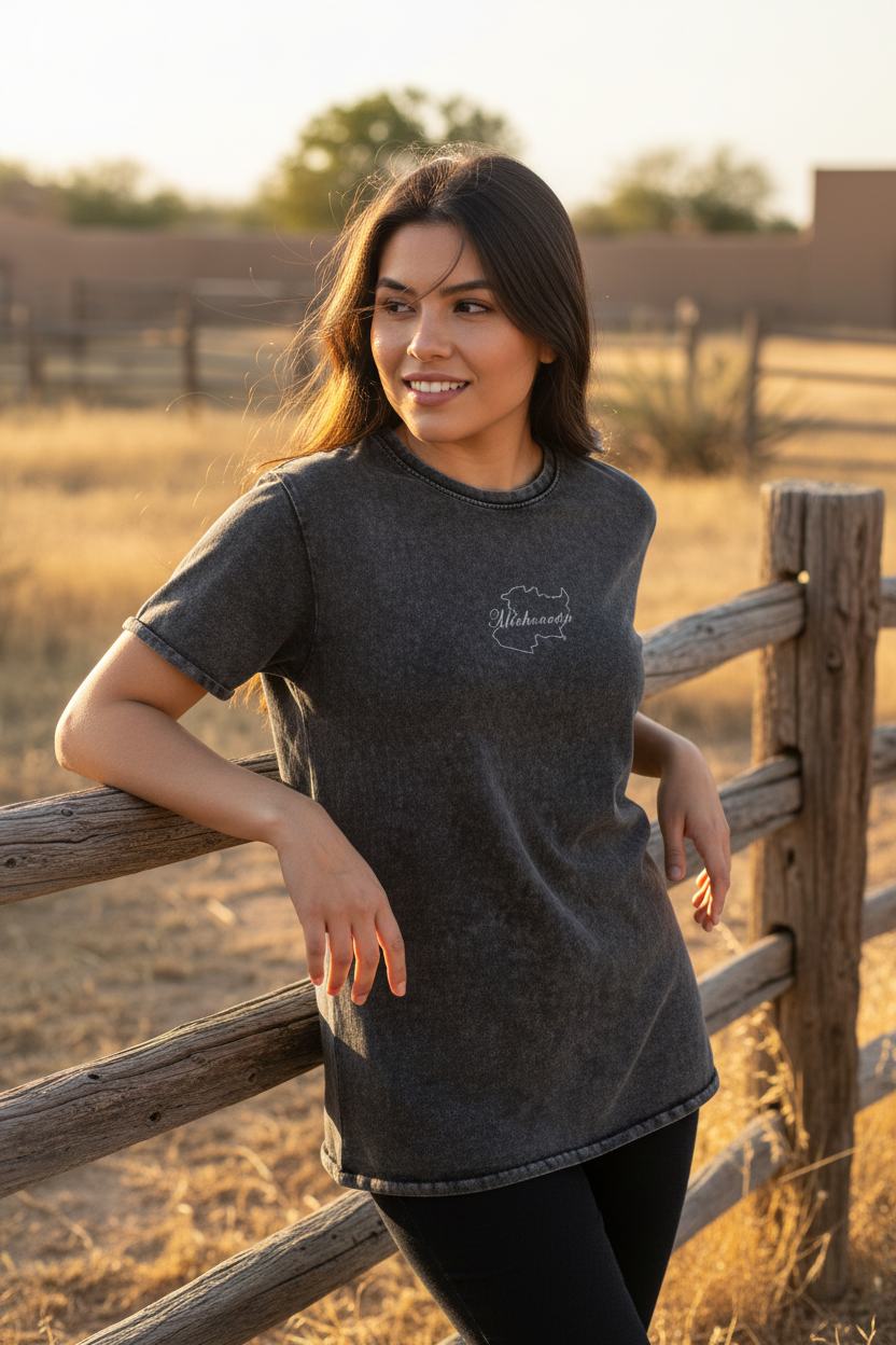 A woman wearing a black denim t-shirt with the text 'Michoacan' written on the front.