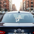 Rear view of a dark-colored Toyota sedan on a city street with a white die-cut decal shaped like the state of Quintana Roo — featuring cursive “Quintana Roo” text centered on the rear windshield, symbolizing Mexican regional pride and minimalist automotive design.