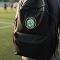 A black athletic backpack with a circular green and white Club Puebla patch FC.