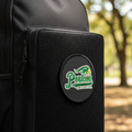 Embroidered Pericos de Puebla patch on black backpack front pocket