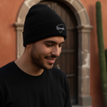 A black beanie with the word 'Yucatan' written on the fold.