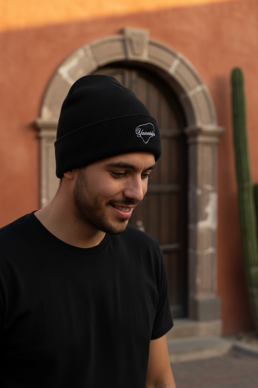 A black beanie with the word 'Yucatan' written on the fold.