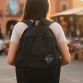 A backpack with a black embroidered patch with the text ' Zacatecas '