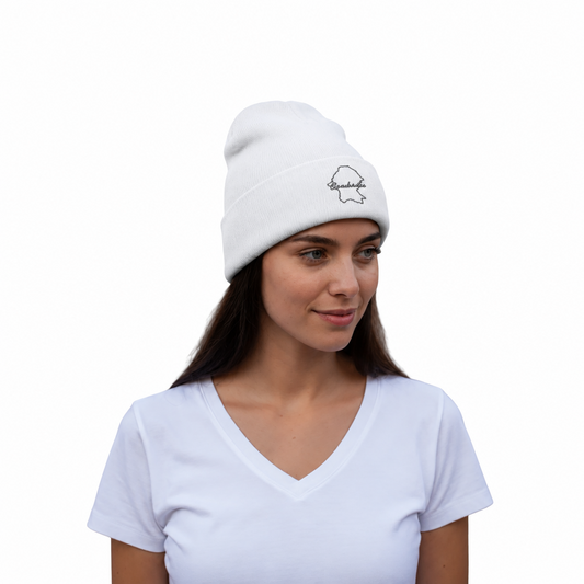Embroidered beanie hat in white with small stitched map patch on the front