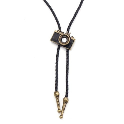 A Cowboy Bolo Tie featuring a synthetic leather necktie with a geometric pattern, a decorative button, and tassel details.