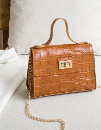 Tan crocodile-pattern shoulder bag with gold buckle and chain strap