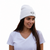 White embroidered beanie hat with small logo patch, knit cuff, one size