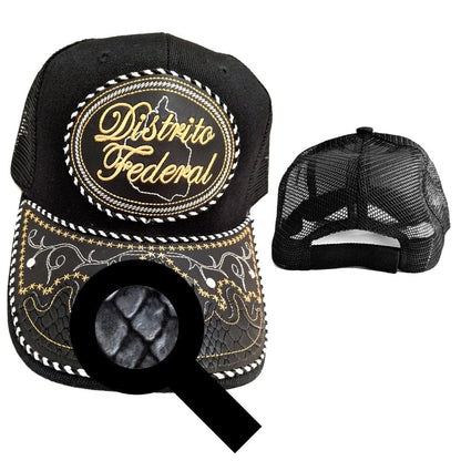 Black trucker cap with round gold-and-white emblem patch, front embroidery, and mesh