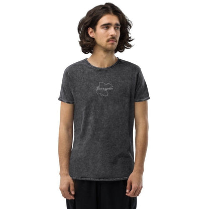 A person wearing a black Guanajuato unisex denim t-shirt with a graphic on the front.