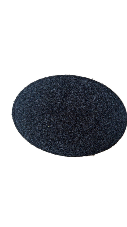 Oval black PU leather patch with textured surface