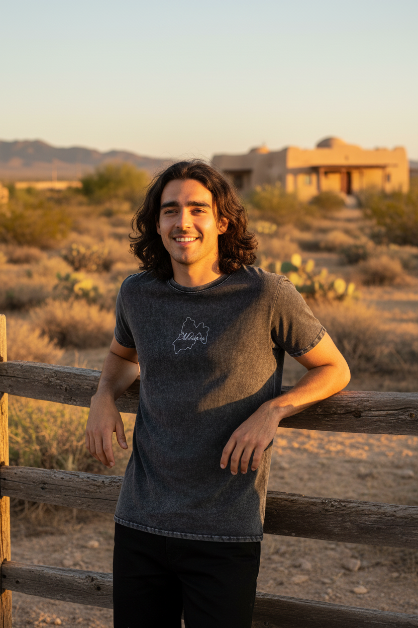 A person wearing a black denim t-shirt with the text 'MEXICO' printed on the front.