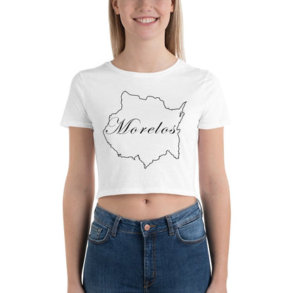A woman wearing a white short-sleeved crop t-shirt with the text 'Morelos' printed in a stylized font on the front, paired with blue jeans.