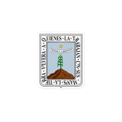 A sticker with the official coat of arms of Morelos, featuring a white background with a graphic of a tree on a mound and text around it.