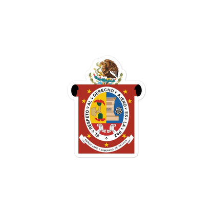 A die cut bubble-free sticker featuring the official coat of arms of Oaxaca. The sticker is white with a graphical design, including a emblem and text, and measures 3 inches by 3 inches.