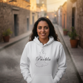 A white unisex premium hoodie with a hood and a front pouch pocket, featuring a black graphic of 'Puebla' on the front.