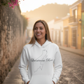A woman wearing a white hoodie with the text 'Quintana Roo' on it.