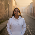 A white unisex premium hoodie with a front pouch pocket and a hood, featuring a Quintana Roo design.