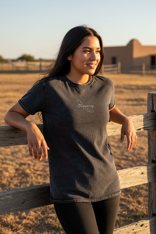 A woman wearing a short-sleeved black denim t-shirt with the text 'Veracruz' on the front.