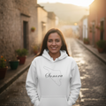 A white Sonora hoodie with a hood and a front pouch pocket, featuring the brand name 'Sonora' in black text on the front.