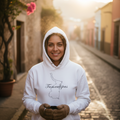 A white hoodie with a 3 panel hood and a front pouch pocket, featuring the text 'Tamaulipas' on the front.