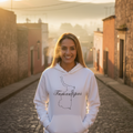 A woman wearing a white hoodie with the text 'Tamaulipas' on it.