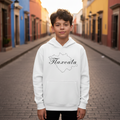 A child wearing a light gray fleece hoodie with 'Tlaxcala' text on it.