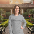 A woman wearing a long sleeve crew neck t-shirt in athletic heather color with the text 'Tlaxcala' on it.