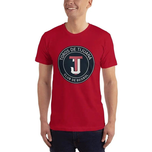 A man wearing a red t-shirt with 'Toros de Tijuana Club de Beisbol' logo on it.