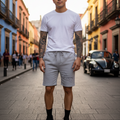 A pair of heather gray fleece shorts with an elastic waistband and drawstring, featuring lined hand pockets and a back pocket.