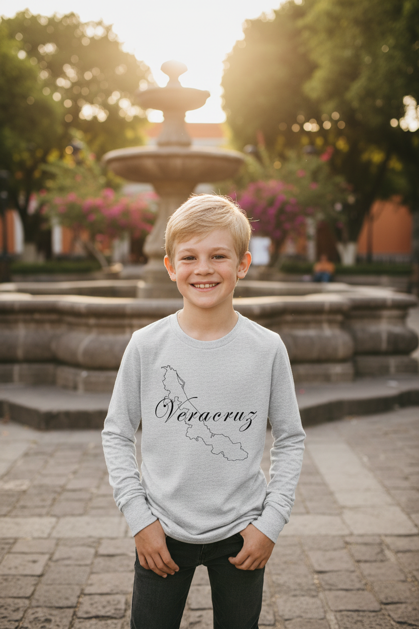 A child wearing a long sleeve gray t-shirt with the text 'Veracruz' printed on the front.