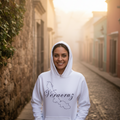 A person wearing a white Veracruz hoodie with a graphic print of the Veracruz state map in black.