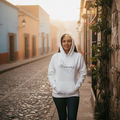 A white Veracruz unisex premium hoodie with a hood and front pouch pocket, displayed against a plain background.
