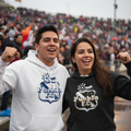 Two smiling fans wearing Puebla F.C.