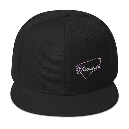 A black snapback cap with the text 'Yucatan' visible on the front.