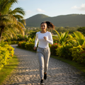 A pair of light gray Yucatan sports jogger pants with a waistband, drawstring, and side pockets. The jogger pants are made of a cotton and polyester blend fabric and are displayed in a standing position with the wearer facing forward.