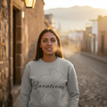 A female wearing a gray unisex sweatshirt with the text 'Zacatecas' printed on the front.
