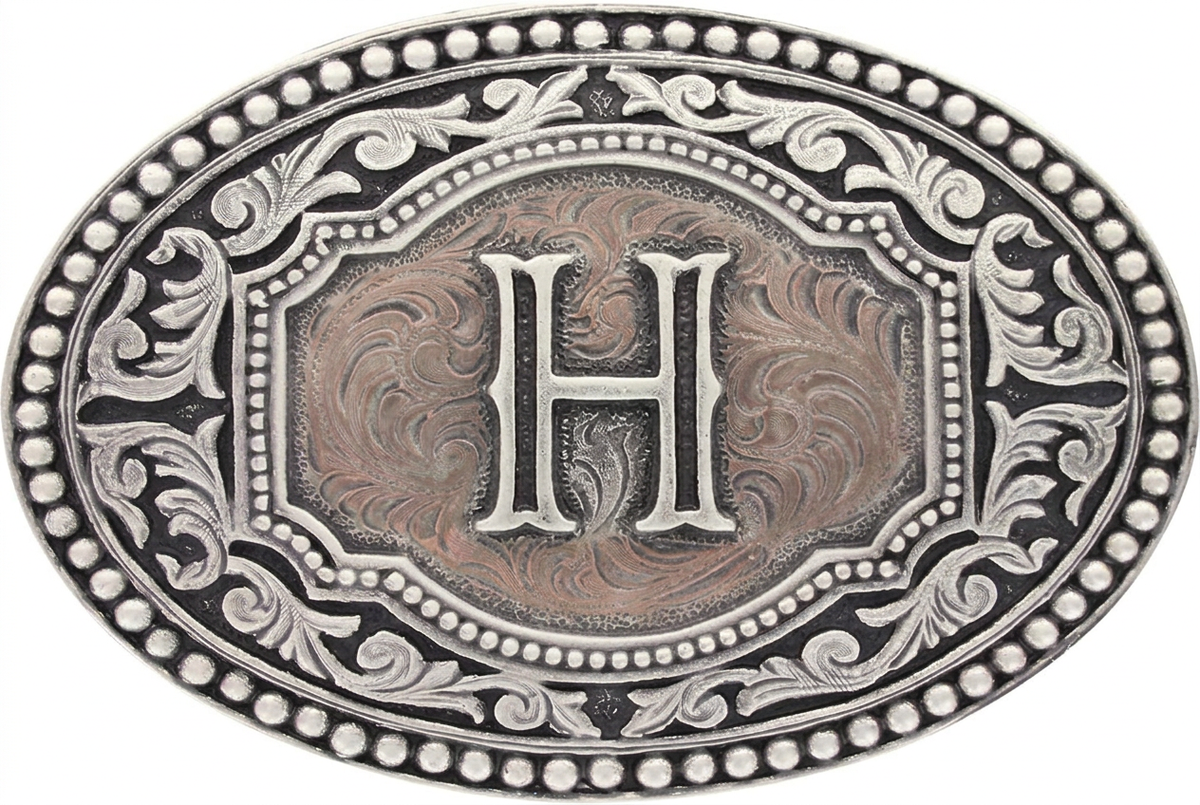 Two-tone western oval belt buckle with raised letter H and engraved floral frame