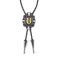 Gray bolo tie with ornate silver pendant and gold letter U center.
